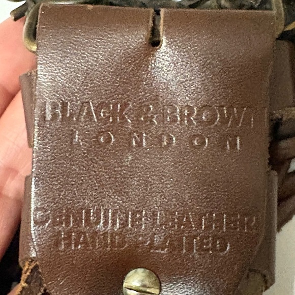 Black & Brown brown leather statement belt. Length is 43 inches. Large buckle.